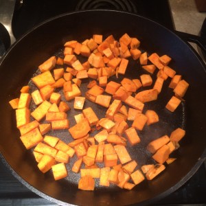 Cooking the sweet potatoes, cumin and salt. 